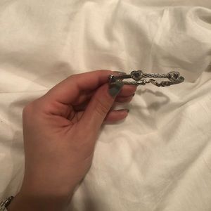 Bangle with 3 onyx hearts.